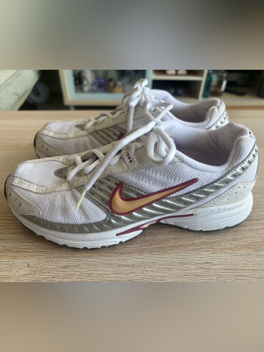 Nike women’s White Running Sneakers with Pink and Gold Swoosh